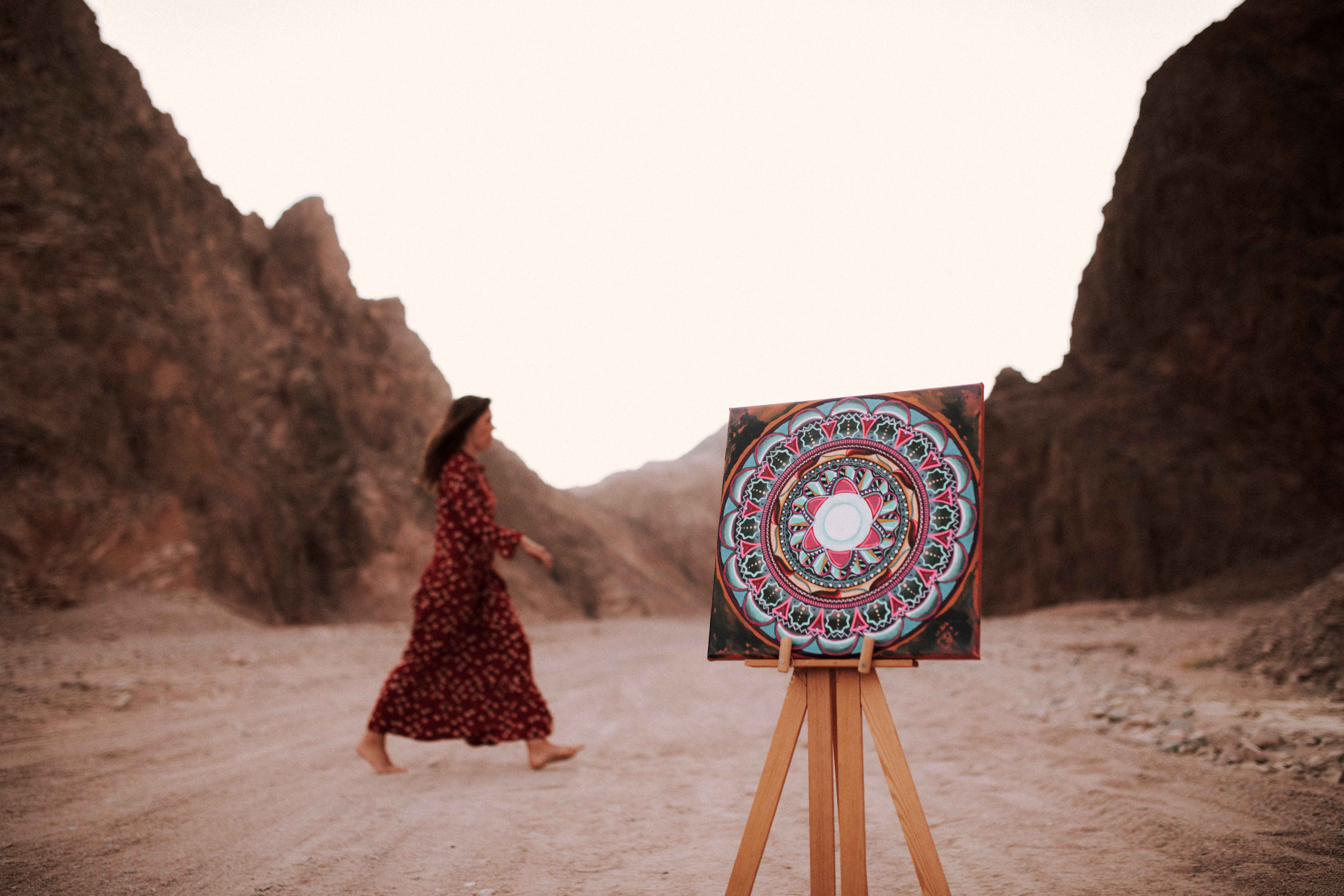 Mandala canvas on easel in desert canyon