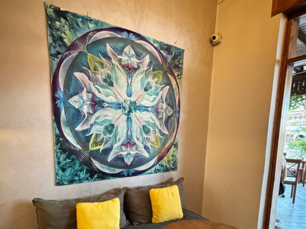 Descend to Rise mandala tapestry in indoor living space